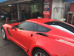 Red Corvette at STAR Certified smog check test only station in Fullerton